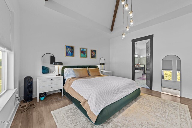 105 Scotland Dr, Youngsville, NC 27596 - bedroom with wood finished floors, baseboards, and connected bathroom