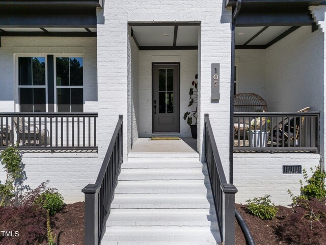 105 Scotland Dr, Youngsville, NC 27596 - entrance to property featuring covered porch and brick siding