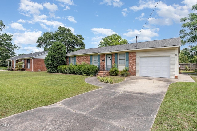 1304 Park Ave, Dunn, NC 28334 - single story home with brick siding, an attached garage, concrete driveway, and a front yard