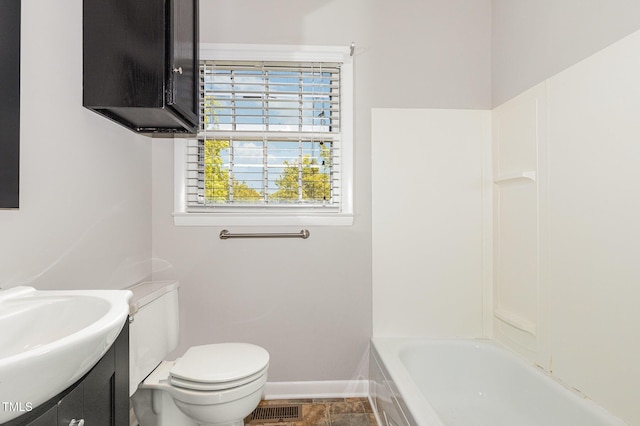 1304 Park Ave, Dunn, NC 28334 - full bathroom with vanity, toilet, and baseboards