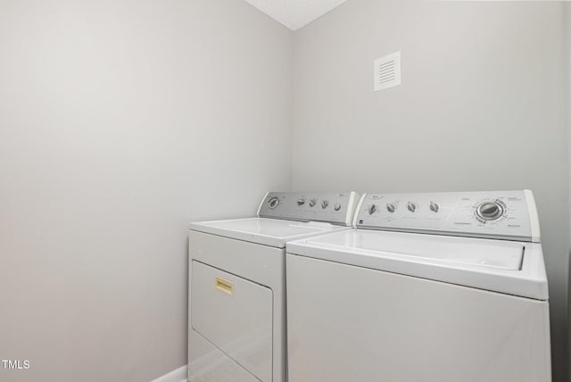 1304 Park Ave, Dunn, NC 28334 - laundry room featuring separate washer and dryer and baseboards