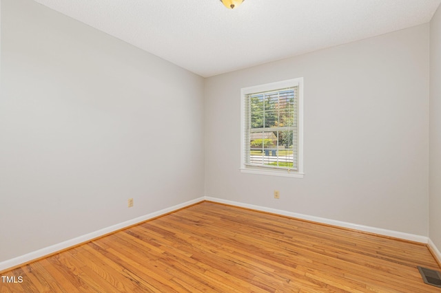 1304 Park Ave, Dunn, NC 28334 - empty room featuring baseboards and light wood-style flooring