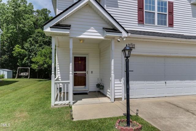 1310 Southgate Dr, Raleigh, NC 27610 - doorway to property with a yard, a garage, roof with shingles, and concrete driveway