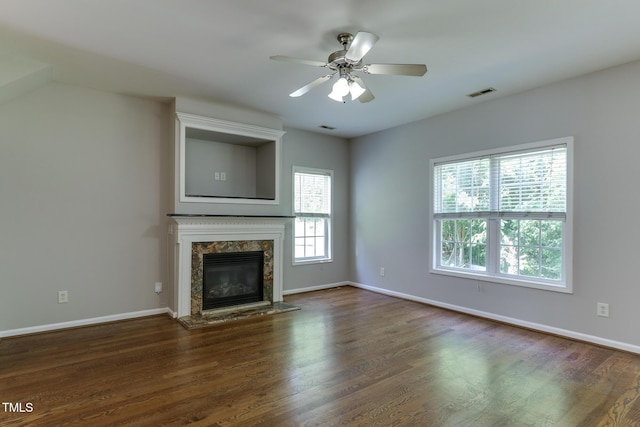 1310 Southgate Dr, Raleigh, NC 27610 - unfurnished living room with a fireplace, wood finished floors, baseboards, and ceiling fan