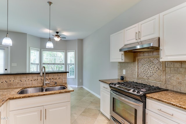 1310 Southgate Dr, Raleigh, NC 27610 - kitchen featuring stainless steel gas range, a sink, under cabinet range hood, decorative backsplash, and light stone countertops
