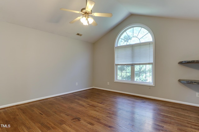 1310 Southgate Dr, Raleigh, NC 27610 - empty room featuring plenty of natural light, vaulted ceiling, wood finished floors, a ceiling fan, and baseboards