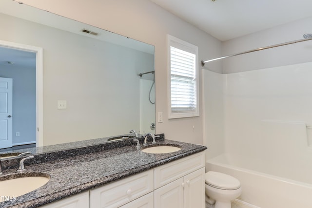 1310 Southgate Dr, Raleigh, NC 27610 - full bathroom featuring bathing tub / shower combination, double vanity, and toilet