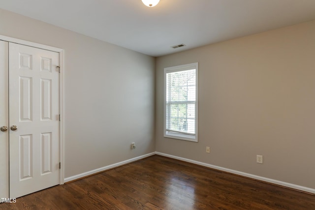 1310 Southgate Dr, Raleigh, NC 27610 - spare room with dark wood-style flooring and baseboards