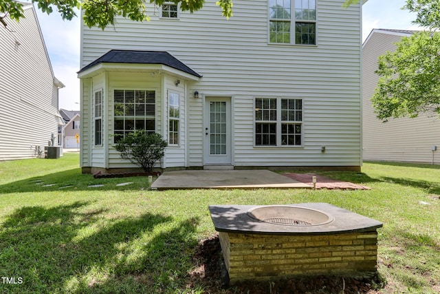 1310 Southgate Dr, Raleigh, NC 27610 - rear view of property featuring a fire pit, a patio, cooling unit, and a yard