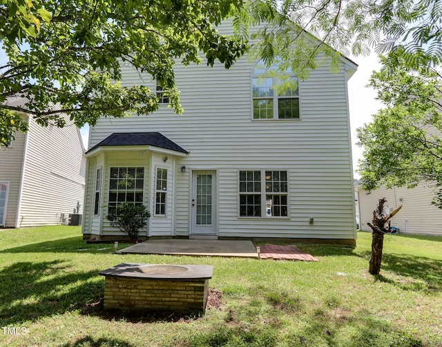 1310 Southgate Dr, Raleigh, NC 27610 - rear view of house with a patio area, a yard, and central AC unit