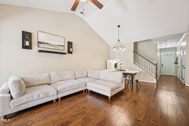 1004 Lake Michael Way, Mebane, NC 27302 - living area featuring vaulted ceiling, dark wood-style floors, ceiling fan, stairway, and a chandelier