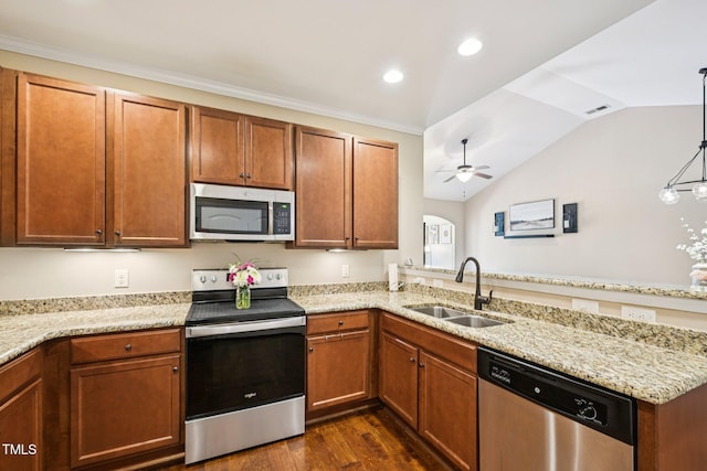1004 Lake Michael Way, Mebane, NC 27302 - kitchen with appliances with stainless steel finishes, a sink, a peninsula, a ceiling fan, and lofted ceiling