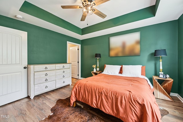 1004 Lake Michael Way, Mebane, NC 27302 - bedroom with a raised ceiling, wood finished floors, ceiling fan, and baseboards