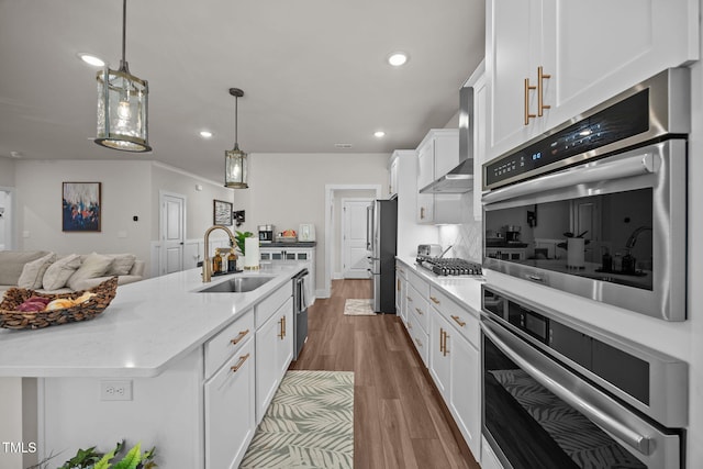 232 Duncan Creek Rd, Lillington, NC 27546 - kitchen with appliances with stainless steel finishes, white cabinets, dark wood finished floors, decorative light fixtures, and open floor plan