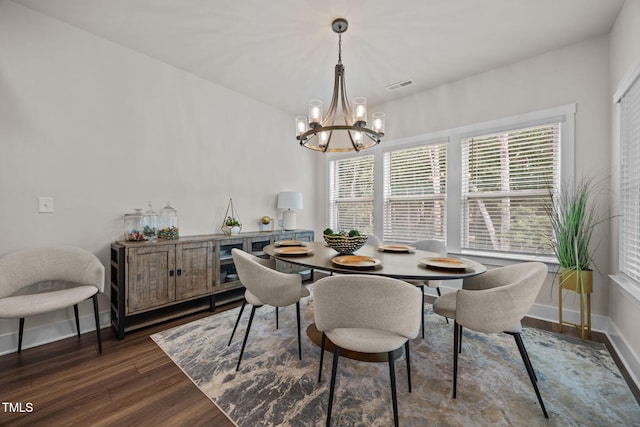 232 Duncan Creek Rd, Lillington, NC 27546 - dining area featuring a chandelier, dark wood-style flooring, and plenty of natural light