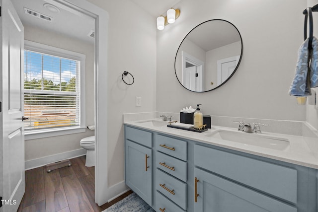 232 Duncan Creek Rd, Lillington, NC 27546 - bathroom featuring double vanity and wood finished floors