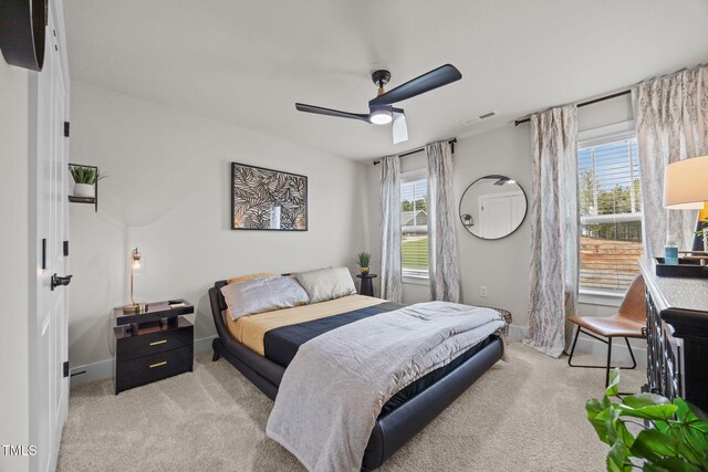 232 Duncan Creek Rd, Lillington, NC 27546 - bedroom featuring light colored carpet, multiple windows, and ceiling fan