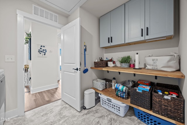 232 Duncan Creek Rd, Lillington, NC 27546 - laundry room with light marble finish flooring and baseboards