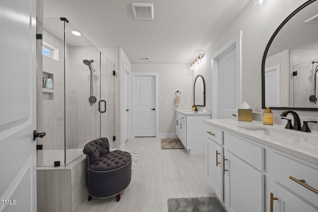 232 Duncan Creek Rd, Lillington, NC 27546 - full bathroom featuring a shower stall, two vanities, and recessed lighting