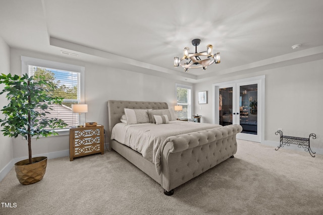 232 Duncan Creek Rd, Lillington, NC 27546 - bedroom featuring french doors, light colored carpet, a raised ceiling, access to outside, and a chandelier