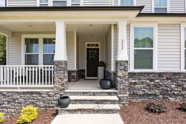 232 Duncan Creek Rd, Lillington, NC 27546 - entrance to property with a porch and stone siding