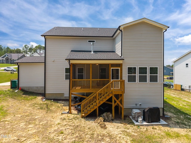 232 Duncan Creek Rd, Lillington, NC 27546 - back of house featuring a sunroom, roof with shingles, and stairway