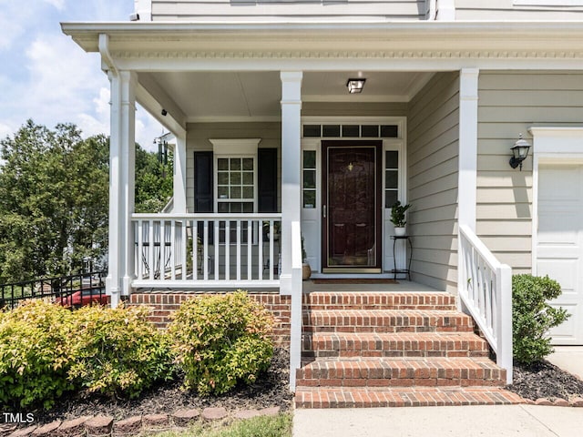 8001 Strawberry Meadows St, Raleigh, NC 27613 - property entrance with a porch