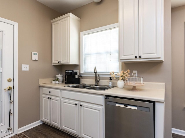 8001 Strawberry Meadows St, Raleigh, NC 27613 - kitchen with stainless steel dishwasher, white cabinets, light countertops, and dark wood finished floors