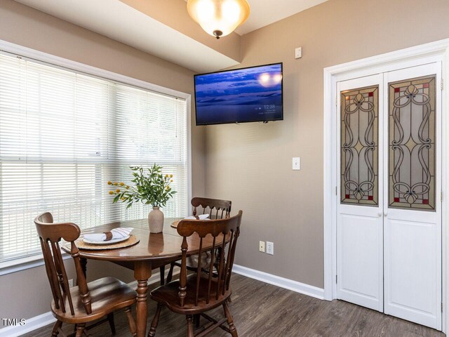 8001 Strawberry Meadows St, Raleigh, NC 27613 - dining area featuring baseboards and dark wood finished floors