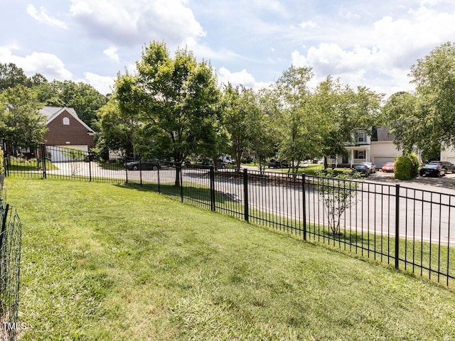 8001 Strawberry Meadows St, Raleigh, NC 27613 - view of yard featuring a garage and driveway