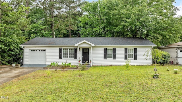 3803 Jonesville Rd, Wake Forest, NC 27587 - ranch-style house featuring driveway, a front yard, an attached garage, and view of wooded area