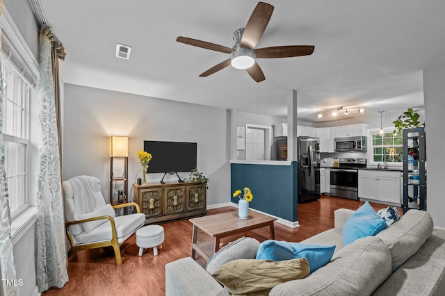 3803 Jonesville Rd, Wake Forest, NC 27587 - living area with a ceiling fan, dark wood finished floors, and baseboards