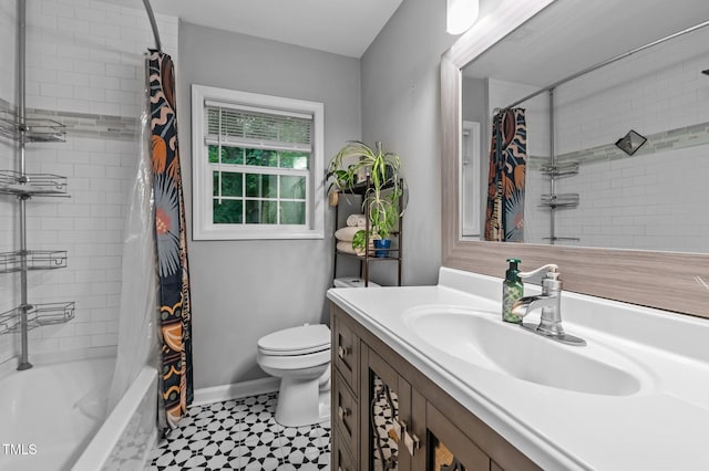 3803 Jonesville Rd, Wake Forest, NC 27587 - bathroom featuring vanity, shower / tub combo with curtain, toilet, and baseboards