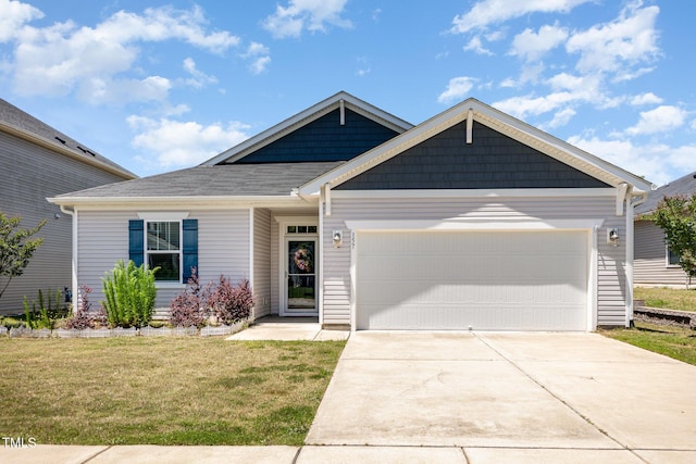 157 Willow Grove Ln, Fuquay Varina, NC 27526 - view of front of house with an attached garage, a front yard, and concrete driveway