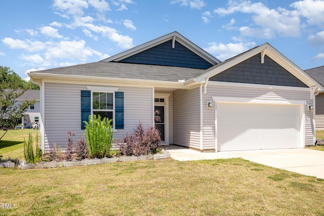 157 Willow Grove Ln, Fuquay Varina, NC 27526 - view of front of home with driveway, an attached garage, a front yard, and roof with shingles