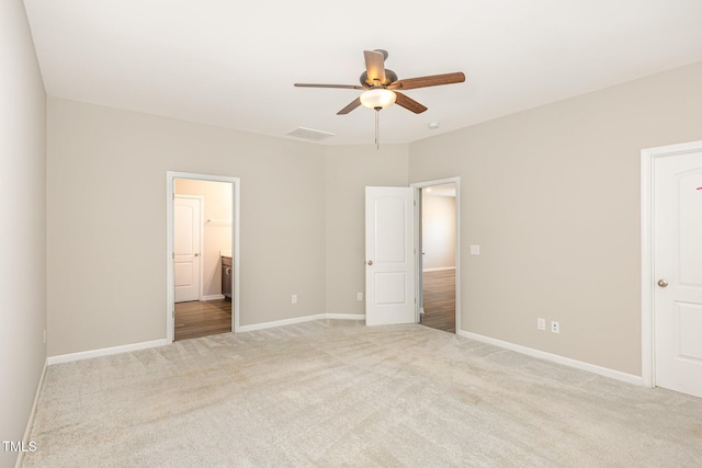 157 Willow Grove Ln, Fuquay Varina, NC 27526 - unfurnished bedroom featuring light carpet, baseboards, and a ceiling fan