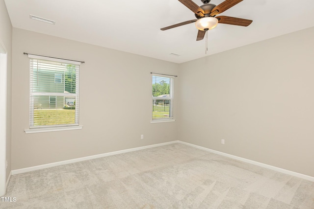 157 Willow Grove Ln, Fuquay Varina, NC 27526 - empty room featuring light carpet, a ceiling fan, and baseboards