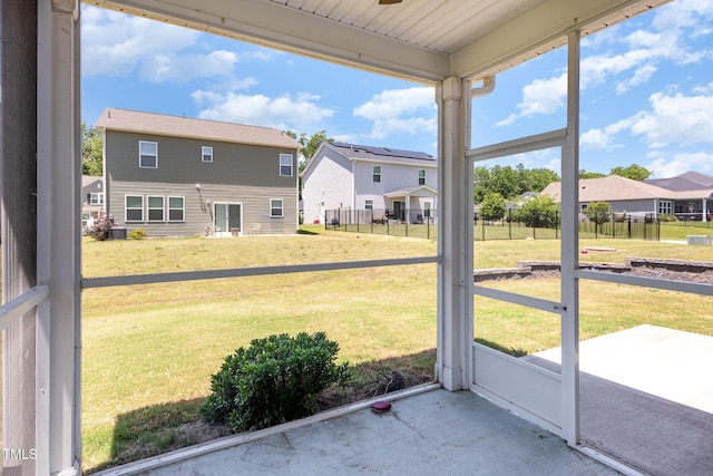 157 Willow Grove Ln, Fuquay Varina, NC 27526 - unfurnished sunroom featuring a residential view, a ceiling fan, and plenty of natural light