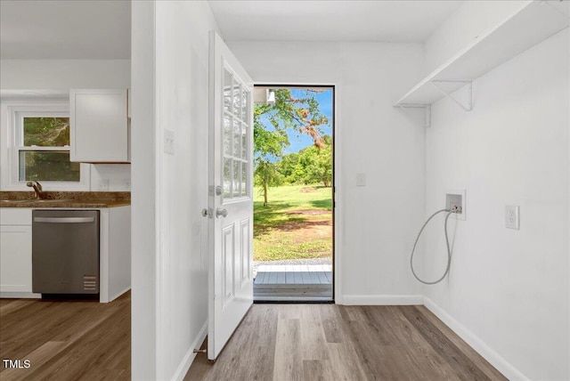 2085 Enon Rd, Oxford, NC 27565 - laundry area featuring light wood-type flooring, washer hookup, and baseboards