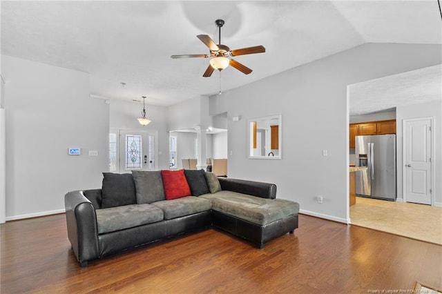 1517 Seabiscuit Dr, Parkton, NC 28371 - living area with a ceiling fan, wood finished floors, baseboards, vaulted ceiling, and decorative columns