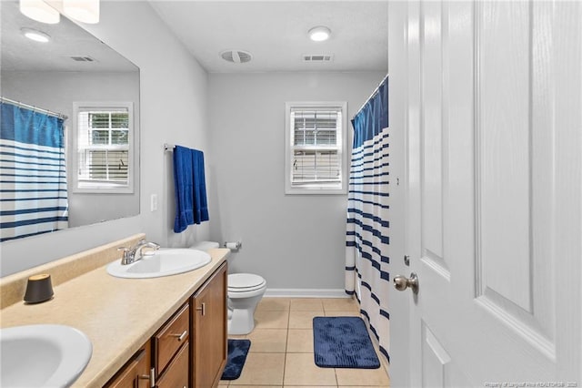 1517 Seabiscuit Dr, Parkton, NC 28371 - full bath with toilet, double vanity, tile patterned flooring, baseboards, and a shower with shower curtain