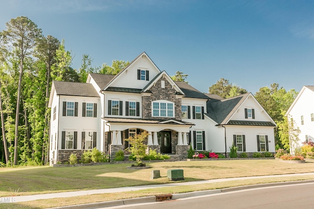 1475 Sierra Glen Cir, Apex, NC 27502 - craftsman-style house featuring stone siding, a standing seam roof, a porch, a front yard, and metal roof