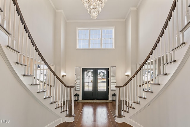 1475 Sierra Glen Cir, Apex, NC 27502 - foyer entrance with stairs, ornamental molding, dark wood-type flooring, a chandelier, and a high ceiling
