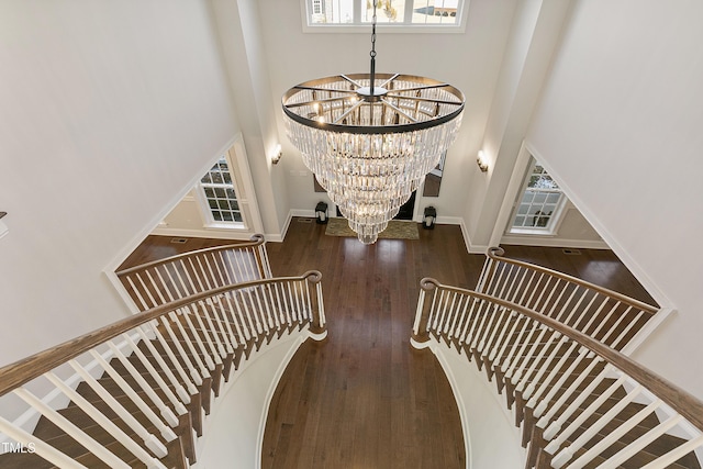 1475 Sierra Glen Cir, Apex, NC 27502 - stairway with a high ceiling, a chandelier, plenty of natural light, and wood finished floors