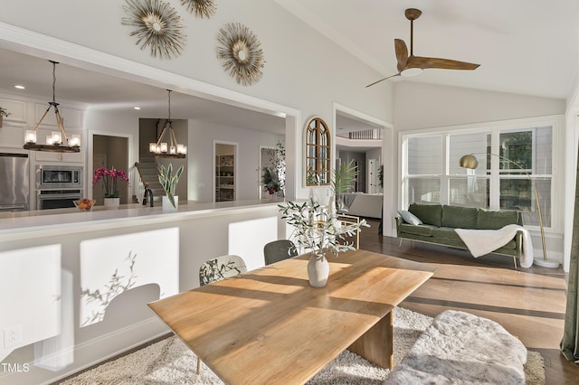 1475 Sierra Glen Cir, Apex, NC 27502 - dining room featuring a chandelier, wood finished floors, ceiling fan, high vaulted ceiling, and recessed lighting