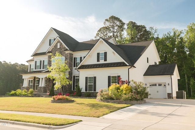 1475 Sierra Glen Cir, Apex, NC 27502 - view of front of home featuring stone siding, an attached garage, a standing seam roof, driveway, and a front lawn