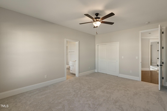 1475 Sierra Glen Cir, Apex, NC 27502 - unfurnished bedroom with light carpet, baseboards, ensuite bath, ceiling fan, and a closet
