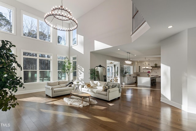 1475 Sierra Glen Cir, Apex, NC 27502 - living area featuring a chandelier, recessed lighting, baseboards, dark wood-type flooring, and a high ceiling