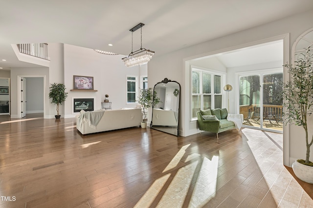 1475 Sierra Glen Cir, Apex, NC 27502 - living room featuring a glass covered fireplace, recessed lighting, and wood finished floors