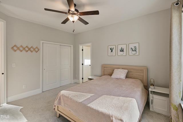 1475 Sierra Glen Cir, Apex, NC 27502 - bedroom with light colored carpet, a closet, baseboards, and a ceiling fan